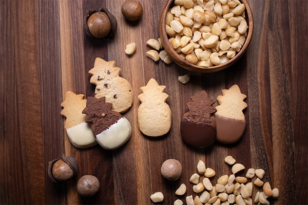 A selection of our cookie flavors feature buttery macadamia nuts.